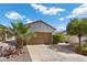 Charming single-story home with a well-manicured front yard and driveway at 2158 Indigo Creek Ave, Henderson, NV 89012