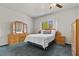 Bright main bedroom with ceiling fan and ample natural light at 2158 Indigo Creek Ave, Henderson, NV 89012