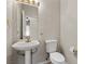 Half bathroom with pedestal sink and classic fixtures at 2158 Indigo Creek Ave, Henderson, NV 89012