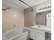 Bathroom featuring tiled shower-tub combo and vanity with mirror at 2200 S Fort Apache Rd # 1033, Las Vegas, NV 89117