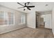 Bedroom with natural light, ceiling fan, and access to bathroom at 2200 S Fort Apache Rd # 1033, Las Vegas, NV 89117