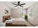 Bright bedroom features a ceiling fan, a window for natural light and neutral walls at 2200 S Fort Apache Rd # 1033, Las Vegas, NV 89117