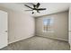 Bedroom features neutral carpet, ceiling fan, and window for natural light at 2200 S Fort Apache Rd # 1033, Las Vegas, NV 89117