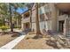 Exterior view of a multi-story home surrounded by mature landscaping at 2200 S Fort Apache Rd # 1033, Las Vegas, NV 89117