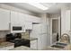Functional kitchen with stainless appliances, granite counters, and ample cabinet storage space at 2200 S Fort Apache Rd # 1033, Las Vegas, NV 89117