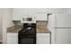 Well-maintained kitchen with white appliances, granite countertops, and plenty of cabinet space at 2200 S Fort Apache Rd # 1033, Las Vegas, NV 89117