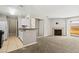 Open concept living space featuring a fireplace, kitchen, and sliding glass doors to the patio at 2200 S Fort Apache Rd # 1033, Las Vegas, NV 89117