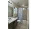 Cozy bathroom features tub/shower combo and vanity, with natural light enhancing the room's appeal at 2229 Steele St, Las Vegas, NV 89156
