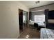 Bright bedroom features a work space and closet with mirrored sliding doors at 2229 Steele St, Las Vegas, NV 89156