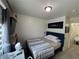 Comfortable bedroom featuring minimalist decor and a mounted TV at 2229 Steele St, Las Vegas, NV 89156