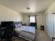 Cozy bedroom with carpet, closet, and modern furnishings at 2229 Steele St, Las Vegas, NV 89156
