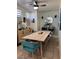 Bright dining area featuring a wood table with seating for six and a modern ceiling fan at 2229 Steele St, Las Vegas, NV 89156