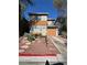 Charming two-story home featuring a well-manicured front yard and an attached one car garage at 2229 Steele St, Las Vegas, NV 89156