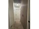 Hallway with a carpet and sleek closet doors features a modern lighting fixture at 2229 Steele St, Las Vegas, NV 89156