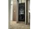 Modern laundry closet showcases a stacked washer and dryer unit at 2229 Steele St, Las Vegas, NV 89156