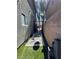 Charming side yard with artificial turf, stone pavers, and water feature at 2229 Steele St, Las Vegas, NV 89156