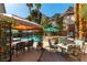 Landscaped backyard features patio, inground pool, gazebo, spa, multiple seating areas perfect for outdoor relaxation and entertaining at 2232 Le Conte Ave, Henderson, NV 89074