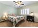 Cozy bedroom offers a ceiling fan, shuttered windows, and a charming desk area at 2232 Le Conte Ave, Henderson, NV 89074