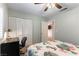 Neutral bedroom showcasing a large closet with a bed dressed in a cactus-themed comforter at 2232 Le Conte Ave, Henderson, NV 89074