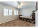 Neutral bedroom with shuttered windows, ceiling fan, and platform bed with storage at 2232 Le Conte Ave, Henderson, NV 89074