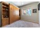 Inviting bedroom featuring a built-in wall bed, shelving, and a bright window at 2232 Le Conte Ave, Henderson, NV 89074