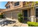 Inviting two-story home featuring a two-car garage and neatly trimmed landscaping at 2232 Le Conte Ave, Henderson, NV 89074