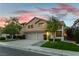 Attractive two-story home with a well-kept lawn and mature trees enhancing curb appeal at 2232 Le Conte Ave, Henderson, NV 89074