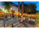Inviting backyard oasis with a charming hot tub, ambient lighting, and comfortable outdoor seating at 2232 Le Conte Ave, Henderson, NV 89074