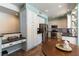 Well-lit kitchen featuring stainless steel appliances, white cabinets, and dining table at 2232 Le Conte Ave, Henderson, NV 89074
