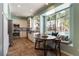 Modern kitchen with stainless steel appliances, white cabinetry, and a window seat overlooking the pool at 2232 Le Conte Ave, Henderson, NV 89074