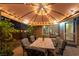 Outdoor dining area with a covered patio, featuring comfortable seating and elegant decor, ideal for evening gatherings at 2232 Le Conte Ave, Henderson, NV 89074
