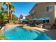 Inviting backyard featuring a sparkling pool and lounge area for outdoor entertainment at 2232 Le Conte Ave, Henderson, NV 89074
