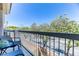 A cozy balcony with comfortable seating, offering a view of lush greenery and a serene neighborhood at 2264 Steamers Ave # 102, Las Vegas, NV 89183