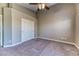 Neutral bedroom featuring plush carpet, double door closet, and ample space at 2264 Steamers Ave # 102, Las Vegas, NV 89183