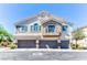 Inviting townhome with a private balcony and three-car garage in a desirable neighborhood at 2264 Steamers Ave # 102, Las Vegas, NV 89183