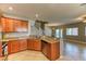 Modern kitchen showcasing granite countertops, wood cabinets, and open-concept design at 2264 Steamers Ave # 102, Las Vegas, NV 89183