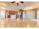 Open-concept living area showcasing tile floors, modern lighting, and seamless kitchen integration at 2264 Steamers Ave # 102, Las Vegas, NV 89183