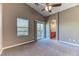 Spacious main bedroom with vaulted ceiling, plush carpeting, and a sliding door to a balcony at 2264 Steamers Ave # 102, Las Vegas, NV 89183