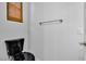 Modern powder room features a black toilet and white walls with a towel rack at 2432 Granada Bluff Ct, Las Vegas, NV 89135