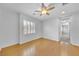 Bedroom featuring hardwood floors and a window with plantation shutters at 2432 Granada Bluff Ct, Las Vegas, NV 89135