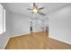 Hardwood bedroom with a ceiling fan and a view of the staircase at 2432 Granada Bluff Ct, Las Vegas, NV 89135