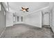 Spacious carpeted bedroom featuring a ceiling fan and ample natural light at 2432 Granada Bluff Ct, Las Vegas, NV 89135