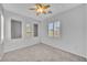 Bright bedroom with plush carpet, recessed wall niches, shuttered windows and a ceiling fan at 2432 Granada Bluff Ct, Las Vegas, NV 89135