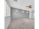Large bedroom with stylish carpet, recessed wall niches, and a ceiling fan at 2432 Granada Bluff Ct, Las Vegas, NV 89135