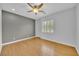 Bedroom with hardwood floors, ceiling fan and plantation shutters at 2432 Granada Bluff Ct, Las Vegas, NV 89135