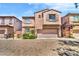 Stylish two-story home with a two car garage and brick paved driveway at 2432 Granada Bluff Ct, Las Vegas, NV 89135