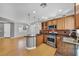 Open concept kitchen with stainless steel appliances, granite countertops, and recessed lighting at 2432 Granada Bluff Ct, Las Vegas, NV 89135