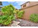 Charming side yard with brick paver walkway, lush landscaping and gated access at 2432 Granada Bluff Ct, Las Vegas, NV 89135