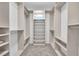Well-organized walk-in closet with multiple shelves and hanging rods, maximizing storage capacity at 2432 Granada Bluff Ct, Las Vegas, NV 89135