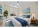 Beautifully staged bedroom featuring bright natural light and neutral color scheme at 2647 Hourglass Dr, Henderson, NV 89052